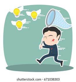 asian businessman trying to catch flying ideas