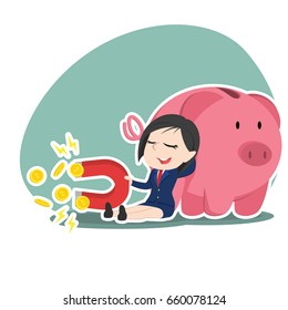 asian businesswoman beside piggy bank holding coin magnet