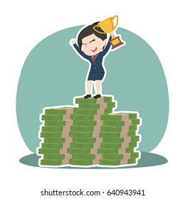 asian businesswoman on top of money stacks with trophy