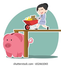 asian businesswoman pushing wheelbarrow money into piggy bank