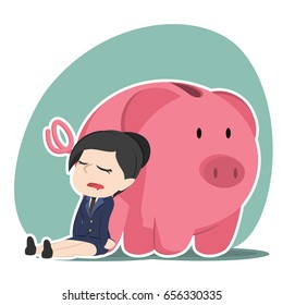 asian businesswoman sleeping beside piggy bank