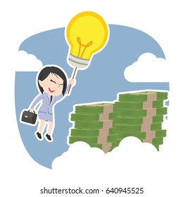 asian businesswoman using her idea to the top of money peak