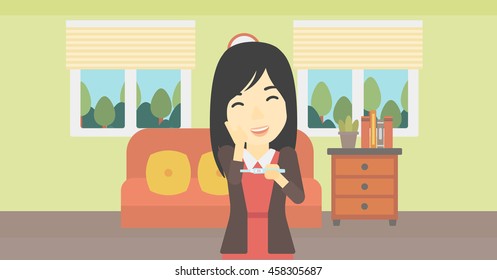 An asian delighted woman looking at positive pregnancy test on the background of living room. Young woman checking pregnancy test. Vector flat design illustration. Horizontal layout.