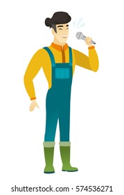 Asian farmer in coveralls singing to the microphone. Full length of farmer singing with closed eyes. Happy farmer singing to the mic. Vector flat design illustration isolated on white background.
