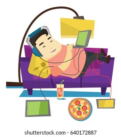 Asian fat man relaxing on a sofa with many gadgets. Man lying on a sofa surrounded by gadgets and fast food. Plump man using many gadgets. Vector flat design illustration isolated on white background.
