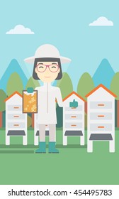 An asian female farmer wearing protective suit. Bee-keeper holding a framework in hand and showing thumb up on the background of apiary. Vector flat design illustration. Vertical layout.