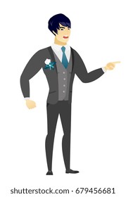 Asian furious groom screaming and pointing his finger to the right. Full length of aggressive groom screaming and shaking his finger. Vector flat design illustration isolated on white background.