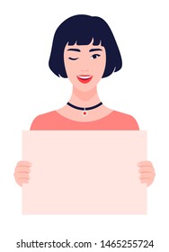 Asian girl holds in her hands a blank poster without text. Winking young woman on a white background. Feminism and women's rights. A student is protesting. Vector illustration in flat style