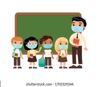 Asian male teacher and international pupils  with protective masks on their faces. Boys and girls dressed in school uniform and male teacher pointing at blackboard cartoon characters. 