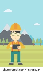 An asian man in hardhat holding a tablet computer in hands on the background of mountain landscape. Man working on digital tablet. Vector flat design illustration. Vertical layout.