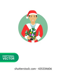 Asian man holding Christmas tree