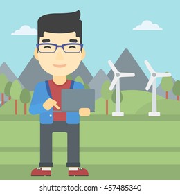 An asian man holding a laptop hands on a background with solar pannels and wind turbins. Man working on computer. Vector flat design illustration. Square layout.