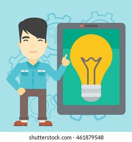 An asian man pointing at a big tablet computer. Man standing near tablet computer with a light bulb on a screen. Vector flat design illustration. Square layout.