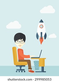 An asian man sitting with his laptop is searching for a new business project. Start up business concept. A contemporary style with pastel palette soft blue tinted background with desaturated clouds