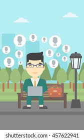 Asian man sitting on a bench in the park and using a laptop with network avatar icons above. Businessman working on a laptop. Social network concept. Vector flat design illustration. Vertical layout.