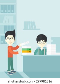 An asian man standing giving a paper work to do to chinese man sitting, stressful man in office with stack of paper on his desk. Business concept in overload work and very busy. A contemporary style