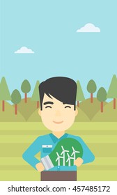 Ein asiatischer Mann steht auf dem Hintergrund des grünen Waldes und hält in Händen eine große Glühbirne mit kleinen Windturbinen innen. Konzept der grünen Energie. Vektorflache Design-Illustration. Vertikales Layout.