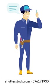 Asian mechanic with speech bubble. Mechanic giving a speech on conference. Mechanic with speech bubble coming out of his head. Vector flat design illustration isolated on white background