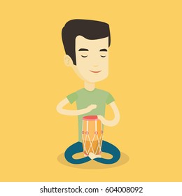 Asian mucisian playing ethnic drum. Young mucisian with eyes closed playing ethnic drum. Man playing ethnic music on tom-tom. Vector flat design illustration. Square layout.