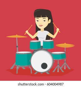 Asian mucisian playing on drums. Young mucisian playing on drums. Smiling young woman playing on drum kit. Happy woman sitting behind the drum kit. Vector flat design illustration. Square layout.