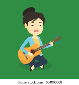 Asian musician playing an acoustic guitar. Friendly musician sitting with guitar in hands. Young female guitarist practicing in playing guitar. Vector flat design illustration. Square layout.