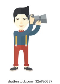 An Asian photographer holding a camera vector flat design illustration isolated on white background. Vertical layout.