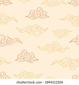 Asian red and orange clouds on a calm yellow background. Seamless decorative doodle pattern. Suitable for packaging, textile, wallpaper.