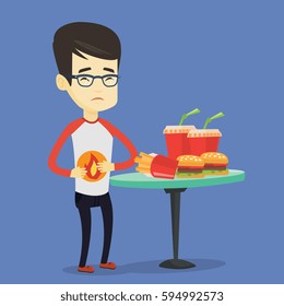 Asian sad man having stomach ache from heartburn. Young man suffering from heartburn. Upset man having stomach ache after fast food. Vector flat design illustration. Square layout.