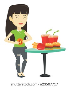 Asian sad woman having stomach ache from heartburn. Young woman suffering from heartburn. Upset woman having stomach ache after fast food. Vector flat design illustration isolated on white background.