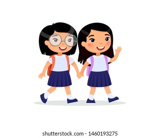 Asian schoolgirls going to school flat vector illustration. Couple pupils in uniform holding hands isolated cartoon characters. Two happy elementary school students with backpacks waving hand and gree