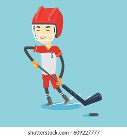Asian sportsman playing ice hockey. Young ice hockey player in uniform skating on a rink. Smiling ice hockey player with a stick and puck. Vector flat design illustration. Square layout.