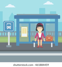 An asian woman with briefcase waiting for a bus at a bus stop on a city background. Young woman sitting at bus stop at the city street. Vector flat design illustration. Square layout.