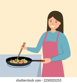 Asian woman cooking lunch or dinner meal in the kitchen. 