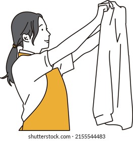 Asian Woman Doing Laundry On Behalf Of Housework