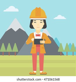 An asian woman in hardhat holding a tablet computer in hands on the background of mountain landscape. Woman working on digital tablet. Vector flat design illustration. Square layout.