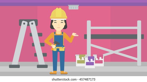 An asian woman in helmet with a hummer and a nail in hands standing on the background of purple walls, paint cans and ladder vector flat design illustration. Horizontal layout.