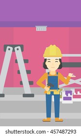 An asian woman in helmet with a hummer and a nail in hands standing on the background of purple walls, paint cans and ladder vector flat design illustration. Vertical layout.
