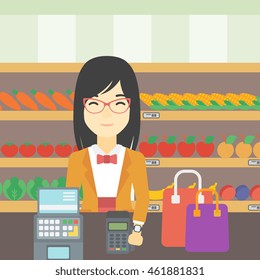 An asian woman paying wireless with her smart watch at the supermarket. Female customer making payment for purchase with smart watch. Vector flat design illustration. Square layout.