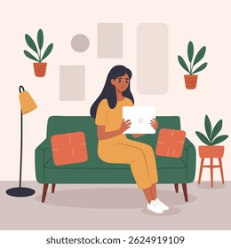 Asian woman relaxing on a cozy green sofa in her living room, working or playing on her tablet, flat illustration, perfect for lifestyle, technology, or home-themed content