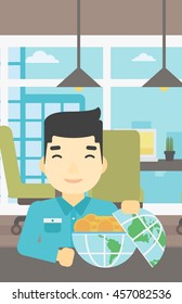 An asian  young businessman sitting at the table in office with a Earth globe full of gold coins. Concept of global business. Vector flat design illustration. Vertical layout.