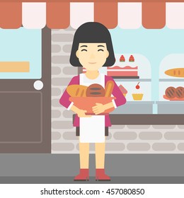 An asian  young female baker holding basket with bakery products. Female baker standing in front of bakery. Baker with bowl full of bread. Vector flat design illustration. Square layout.