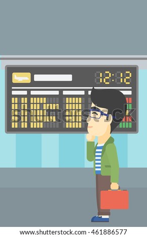 An asian young man with a briefcase looking at departure board at the airport. Passenger standing at the airport in front of departure board. Vector flat design illustration. Vertical layout.