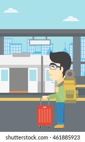 An asian young man standing at the train station on the background of train with open doors. Young man with suitcase waiting for a train. Vector flat design illustration. Vertical layout.