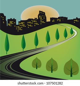 The asphalt road to the town lined with trees