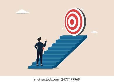 Aspiration to achieve goal, concept of reach target or reach goal, businessman walking up stair to reach goal.