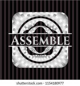 Assemble silver emblem