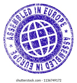 ASSEMBLED IN EUROPE stamp watermark with grunge texture. Blue vector rubber print of ASSEMBLED IN EUROPE tag with grunge texture. Seal has words arranged by circle and globe symbol.