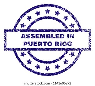 ASSEMBLED IN PUERTO RICO seal print with dirty effect. Designed with rectangle, circles and stars. Blue vector rubber print of ASSEMBLED IN PUERTO RICO text with unclean texture.