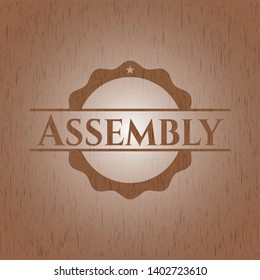 Assembly badge with wood background