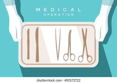 Assistant of the surgeon holds surgical instruments on the medical tray